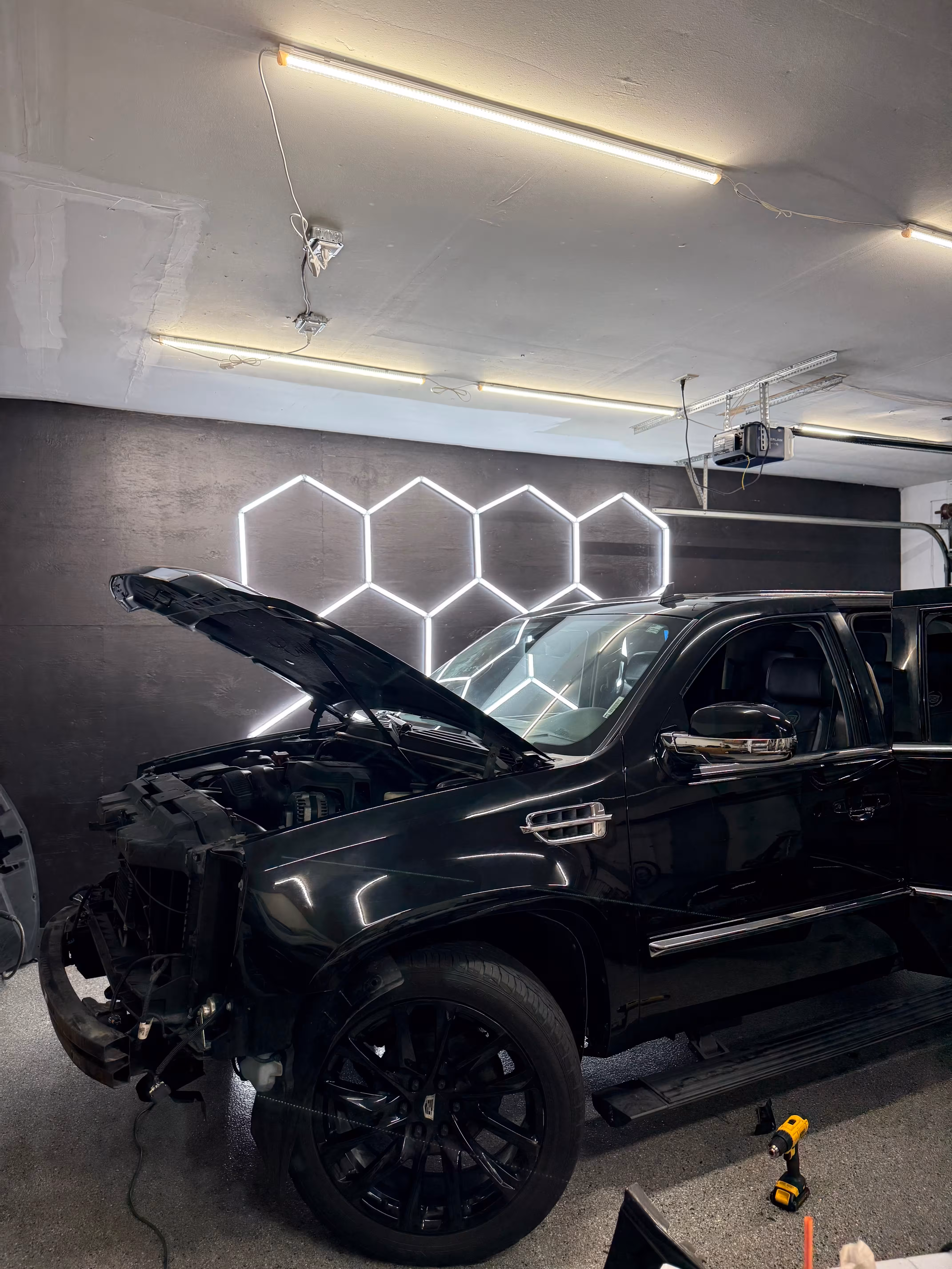 Cadillac hood open in garage